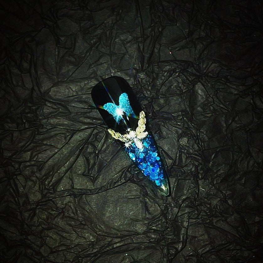The Art Edit | Blue-Black Butterfly Stiletto Press-On Nails | Crushed Crystal Glitter + Silver Bow Charms