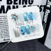 Icy Blue Nails with Iridescent Wash and Star Accents