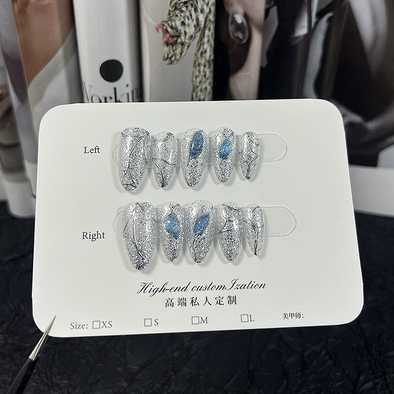 Silver Glitter Cat Eye Press‑On Nails with Blue Gem & Web Design