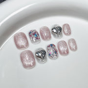 Fresh Summer Glitter Nails with Playful Silver Heart Charms