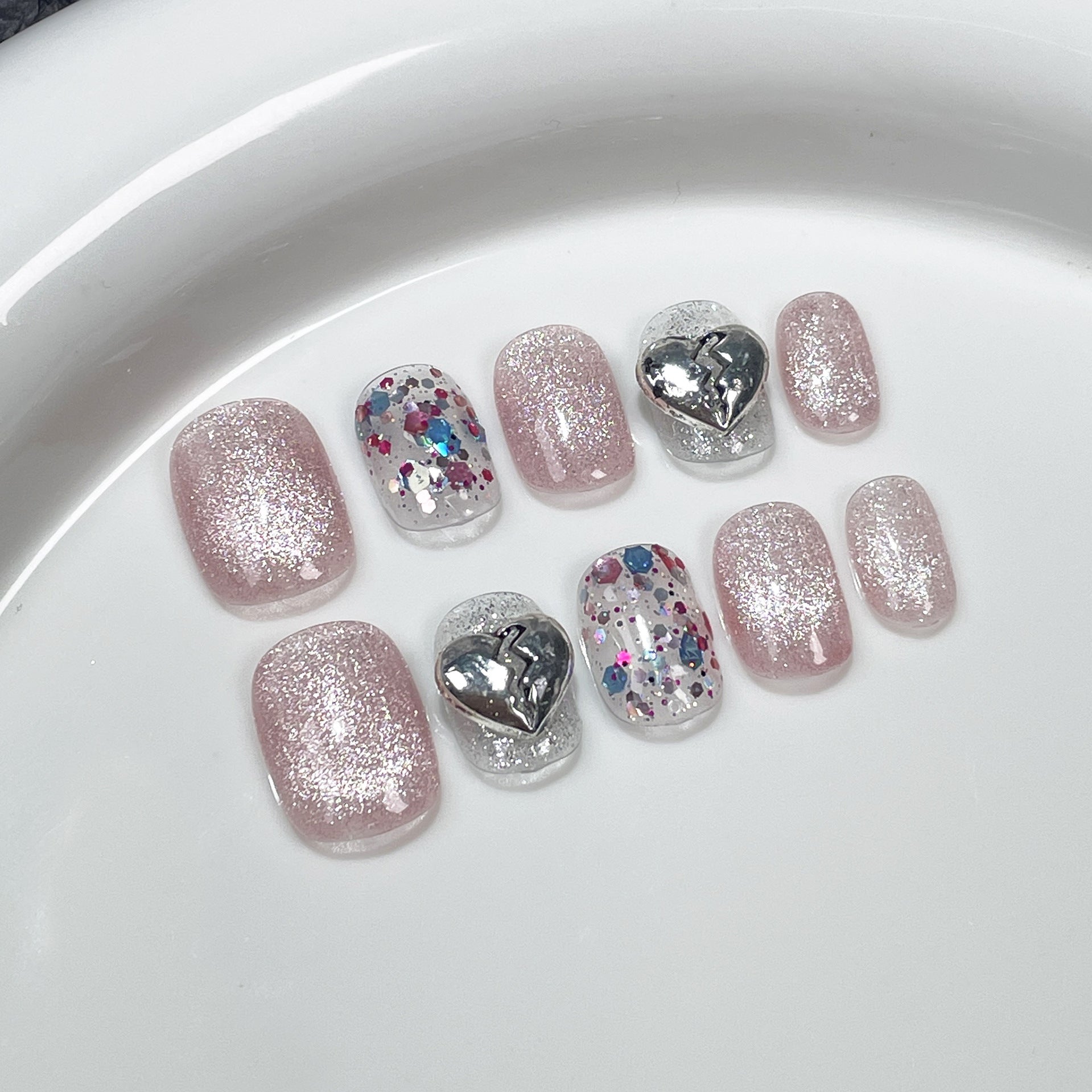 Fresh Summer Glitter Nails with Playful Silver Heart Charms