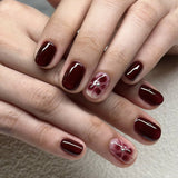 Elegant Burgundy Nails with Floral Accent Art