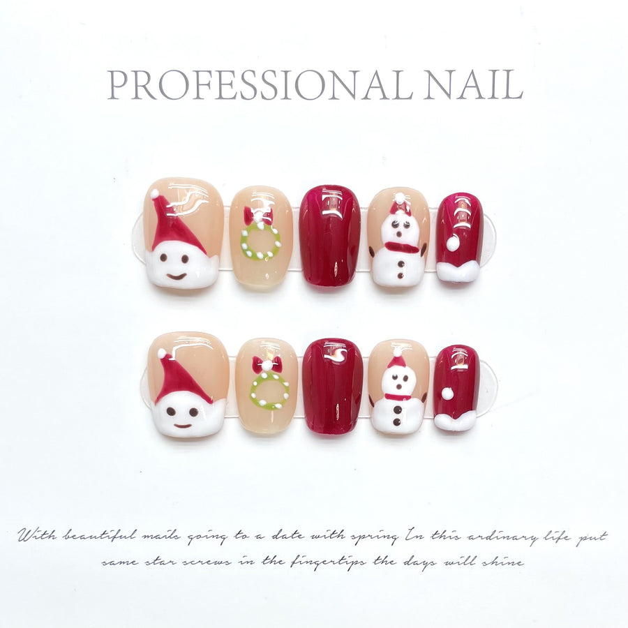 Ongles press-on de Noël mignons – Père Noël et bonhomme de neige, rouge et nude, design festif