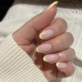 Soft Pink Almond Nails with Yellow French Tip Glow