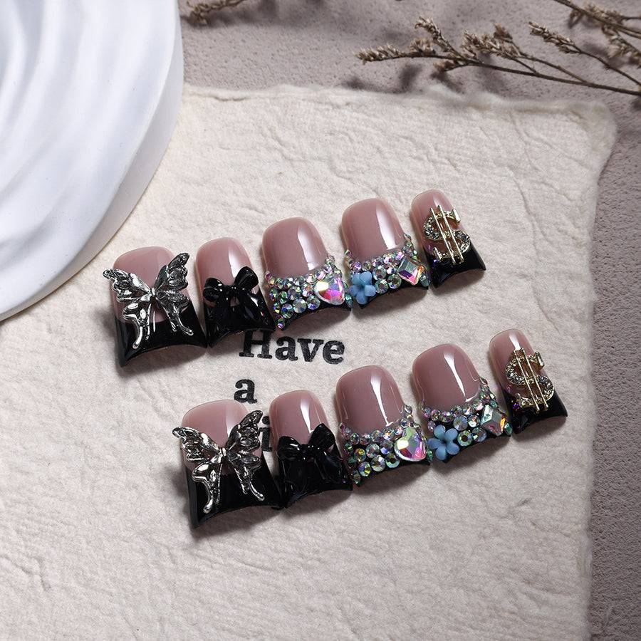 Ongles press-on French noirs avec papillon en cristal