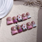 Pink French Nails with Floral Shell Accents and Soft Pearls