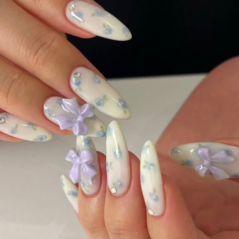 Long Stiletto Press On Nails with White Base & Purple Floral & Bow Accents