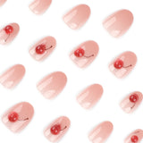 Soft Pink Glossy Nails with Red Cherry Accents