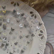 金箔蝴蝶與蝴蝶結：「優雅鍍金蝴蝶」— 5D 浮雕指甲貼