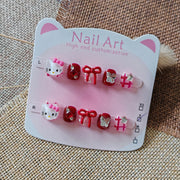 365Nails: "Hello Kitty Laço Rubi" – Unhas Postiças Curtas Ovais Feitas à Mão