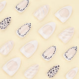 Chic Monochrome Nails with Dalmatian Spots and White Accents