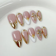 Ongles rose poudré élégants avec cadre doré et accents croix chics