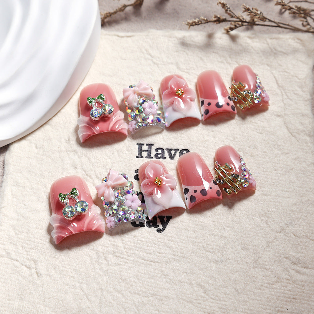 Pink Peach Nails with Floral Charms and Crystal Details
