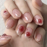 Soft Pink Glossy Nails with Red Cherry Accents