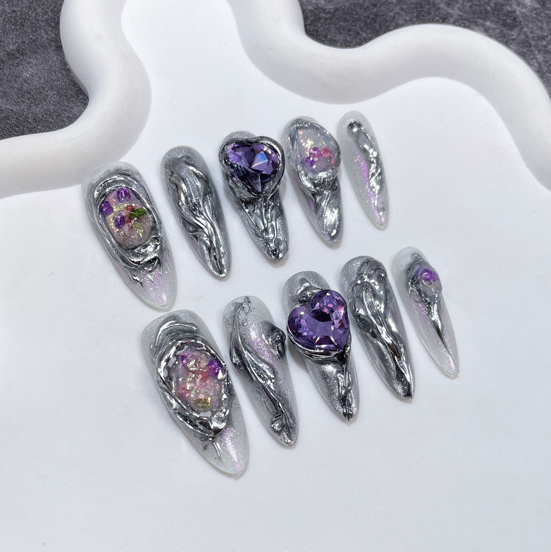 Meteorite-Inspired Metallic Nails with Amethyst Crystal Cores