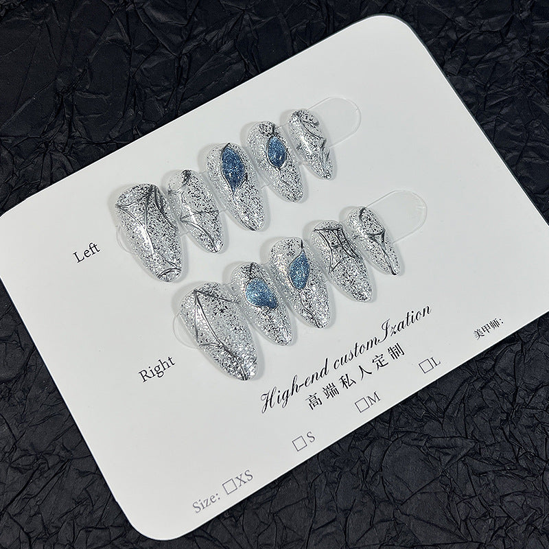 Silver Glitter Cat Eye Press‑On Nails with Blue Gem & Web Design