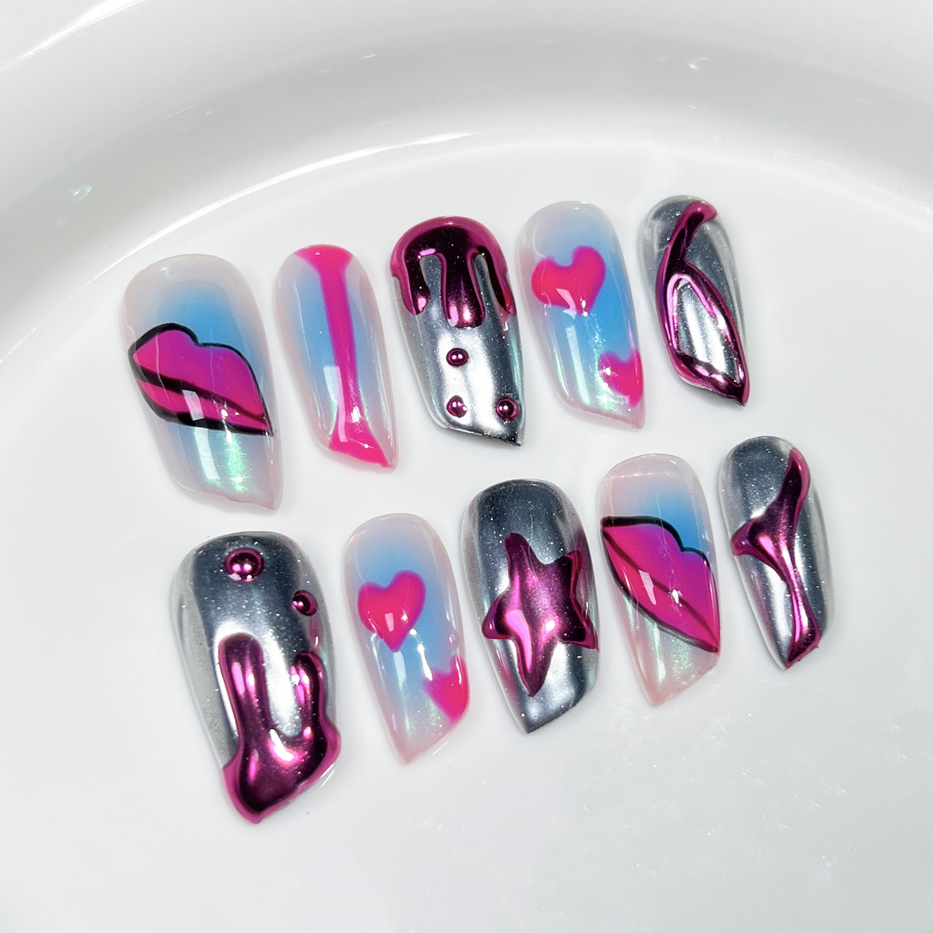 Bold Blush Nails with Sculpted Lip Art and Metallic Pop Accents
