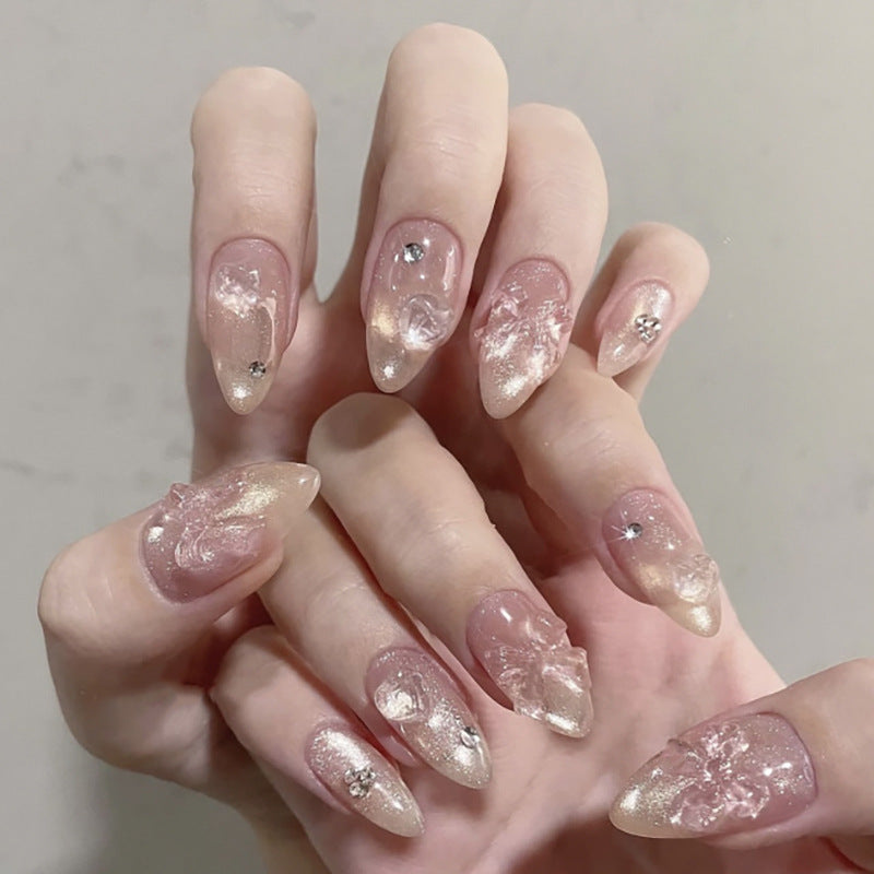 Ongles press-on brillants avec nœud rose et breloque perle