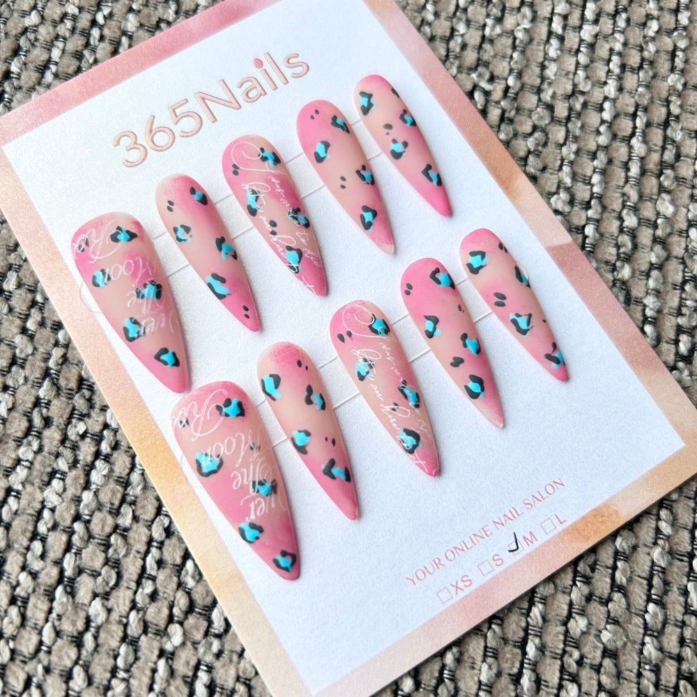 Femme Fatale: "Pink Panther" – Matte Nude to Rose Ombre with Turquoise & Black Leopard Print & White Cursive Text Long Stiletto Nails