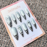 Femme Fatale: "Silver Glacial Melt" – Icy White Cat Eye Base with 3D Liquid Chrome French Tips & Silver Stars Long Stiletto Nails