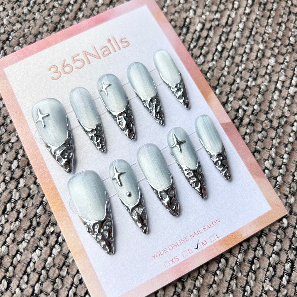 Femme Fatale: "Silver Glacial Melt" – Icy White Cat Eye Base with 3D Liquid Chrome French Tips & Silver Stars Long Stiletto Nails