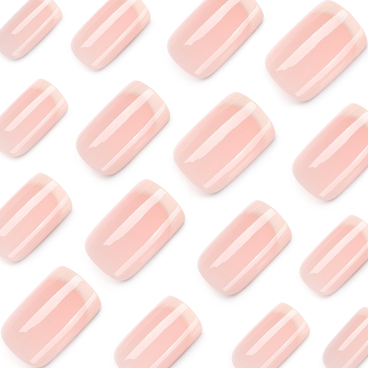 Close-up of pale pink glossy press-on nails on white background