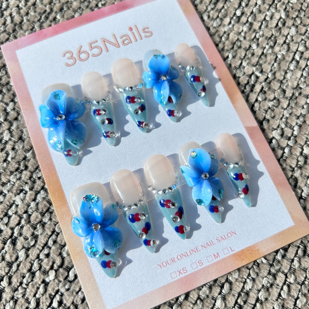 Sculpted Flora: "Ice Blue Velvet" – 3D Blue Flower & Red-Blue Polka Dot French Stiletto Nails with Rhinestones