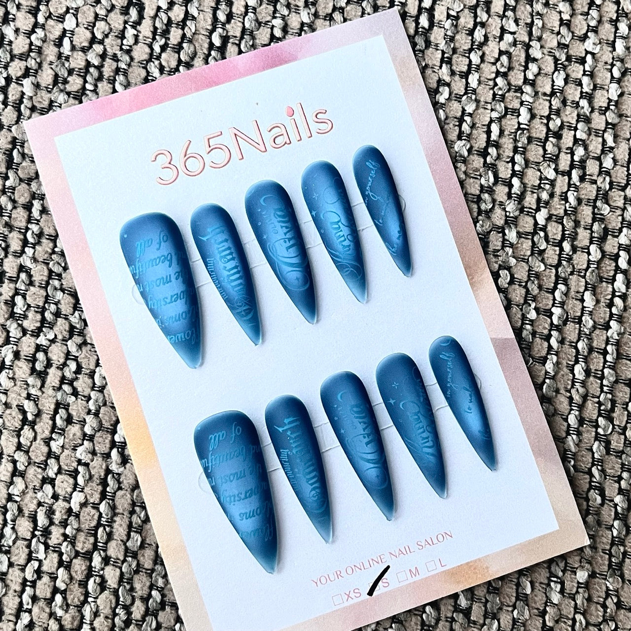 Matte Blue Embossed Text Stiletto Press-On Nails