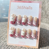 Sculpted Flora: "Pink Crystal Blossom" – 3D White Floral & Glitter Pink French Square Nails