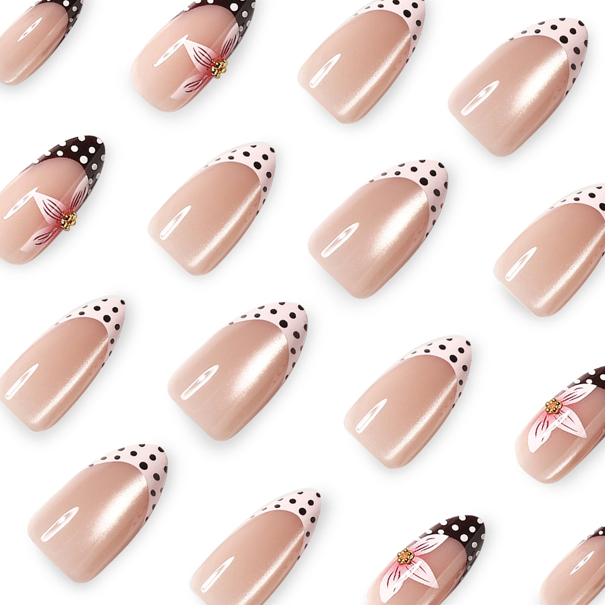 Close-up of nude almond nails with black and white polka dot French tips