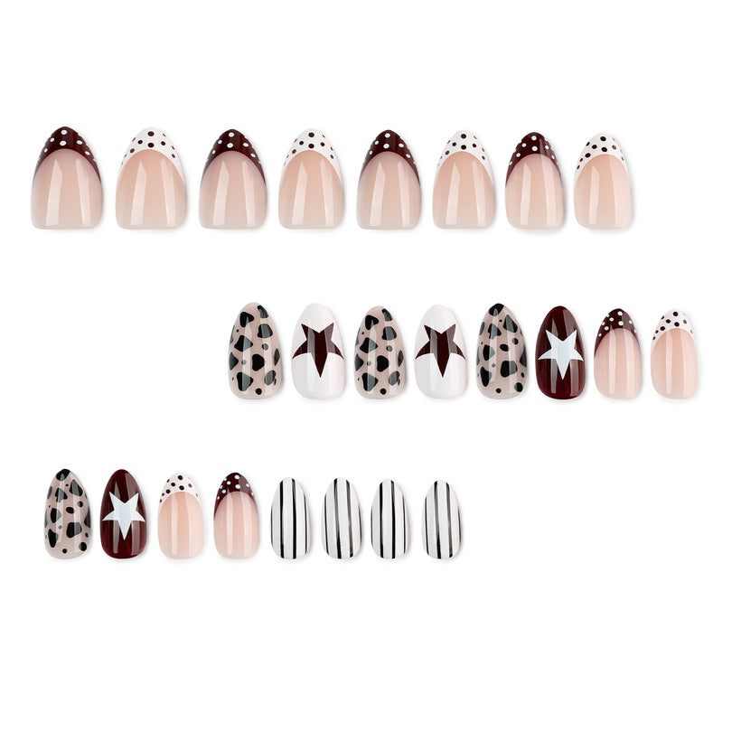 Set of short almond press-on nails arranged in rows with leopard, star, stripe and dotted designs.