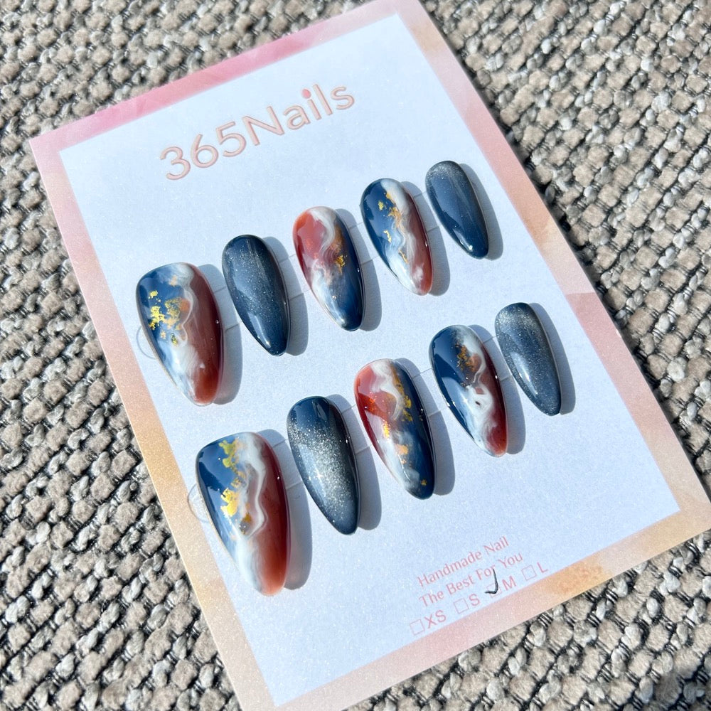 "Midnight Magma" – Navy Blue Cat Eye & Amber Russet Ink Marble with Gold Foil Almond Nails