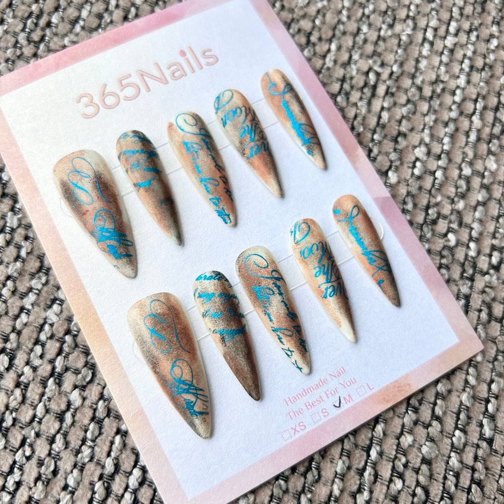 Femme Fatale: "Sepia Manuscript" – Vintage Burnt Brown Airbrush with Blue Calligraphy Script Long Stiletto Nails