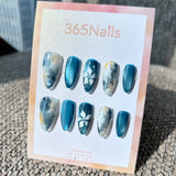 Ethereal Ink: "Azure Mist Floral" – Dusty Blue Cat Eye & Ink Marble with Hand-Painted White Flowers & Gold Foil Almond Nails