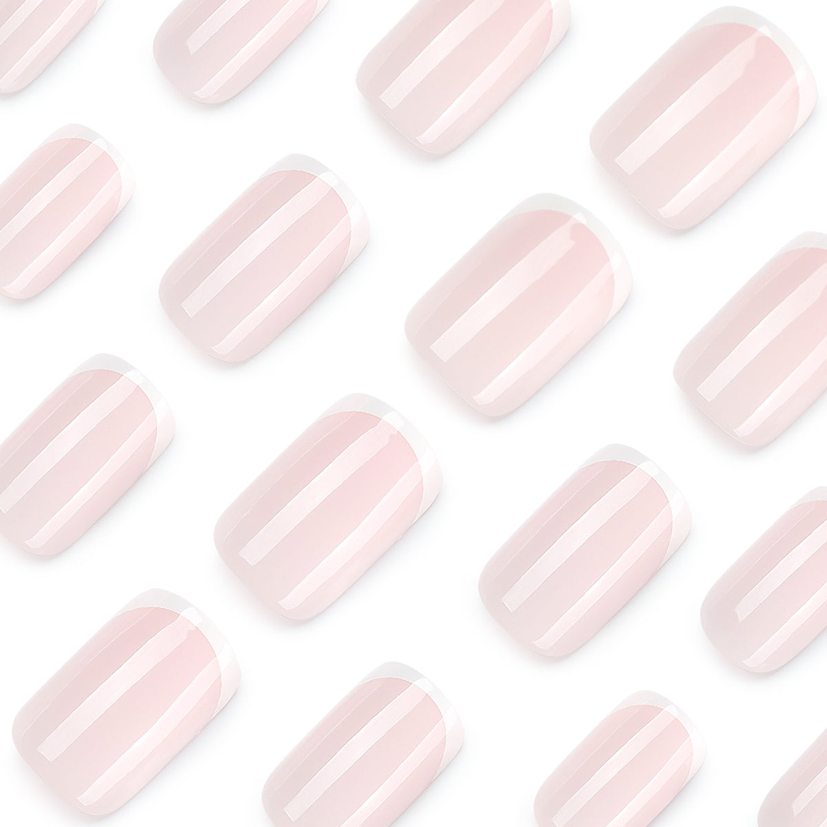 Close-up of pale pink French tip press-on nails