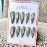 Femme Fatale: "Silver Mist" – Grey Cat Eye with Flash Glitter French Tips & Crystal Bow Charm Long Stiletto Nails