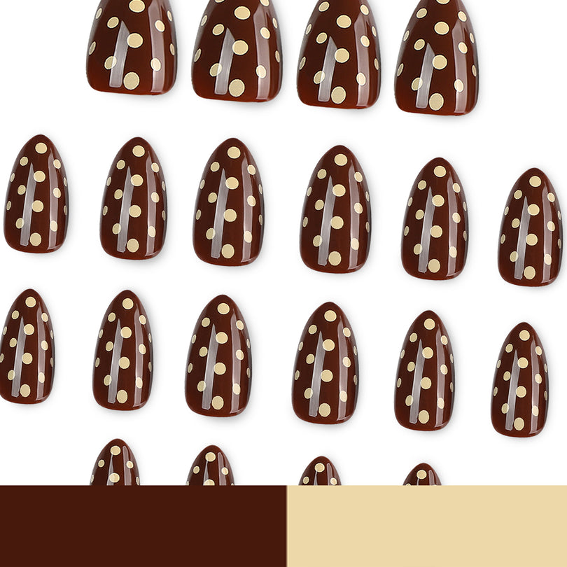 Many brown polka-dot press-on nails arranged in rows