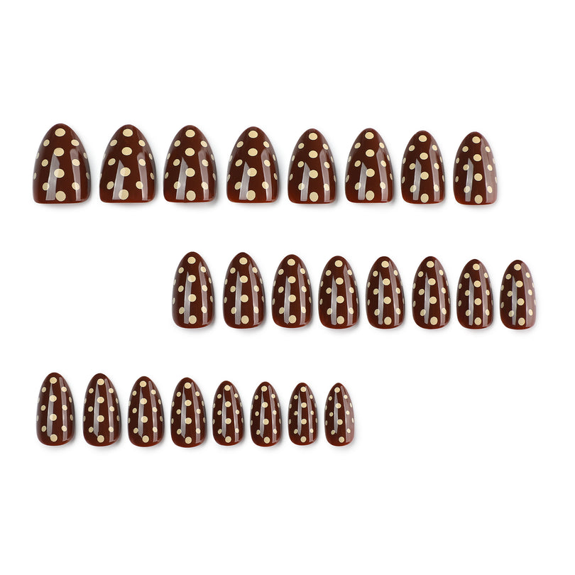 Set of 24 brown polka-dot press-on nails on white background