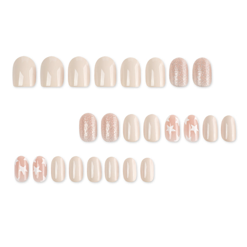 Full set of 24 press-on nails laid out in rows: glossy nude, rose glitter, and pink nails with white stars