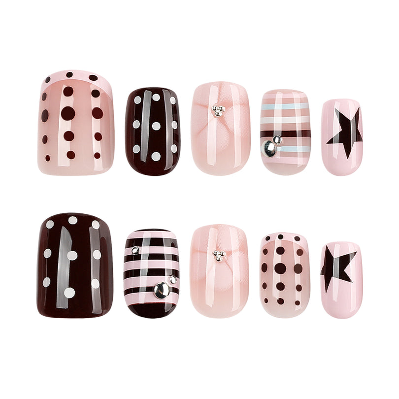 Two rows of ten press-on nails showing pink, brown, plaid, dot, bow, and star designs.