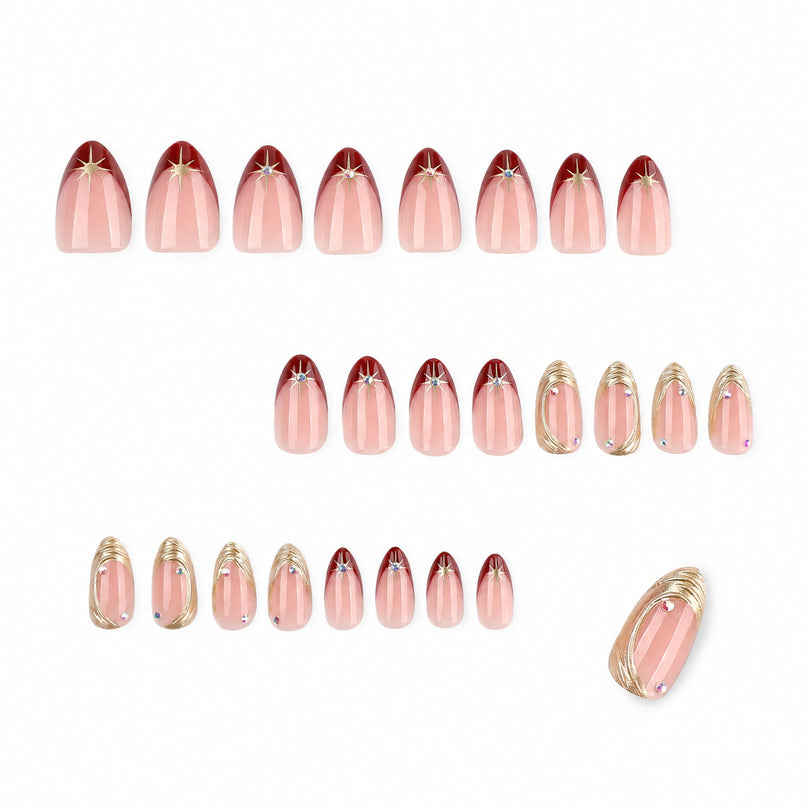 Set of 24 almond press-on nails in nude pink, burgundy, and gold designs.