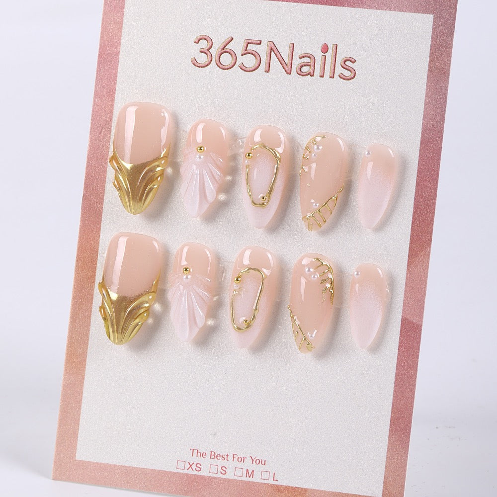 365nails nude pink shimmer with shell carving, gold edging and pearls almond press-onsSold in packs of 5. Minimum order: 1 pack (5 pcs). Quantity = number of packs. Qty 1 = 5 pcs