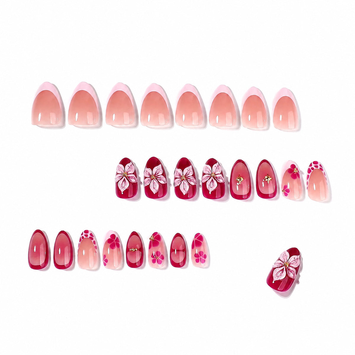 Full set of almond press-on nails laid out in rows, nude base and floral designs