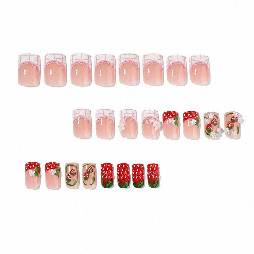 Full set of short square press-on nails arranged in rows with 3D strawberry details