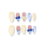 365Nails Butter Yellow Floral Carving with Blue‑White Porcelain Patterns, Jelly Beads & French Mix – Fresh Medium Almond Press‑On NailsSold in packs of 5. Minimum order: 1 pack (5 pcs). Quantity = number of packs. Qty 1 = 5 pcs