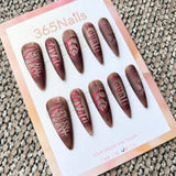 Femme Fatale: "Crimson Ink" – Matte Brown Base with Metallic Red Gothic Lettering, Tattoo Style Long Stiletto Nails