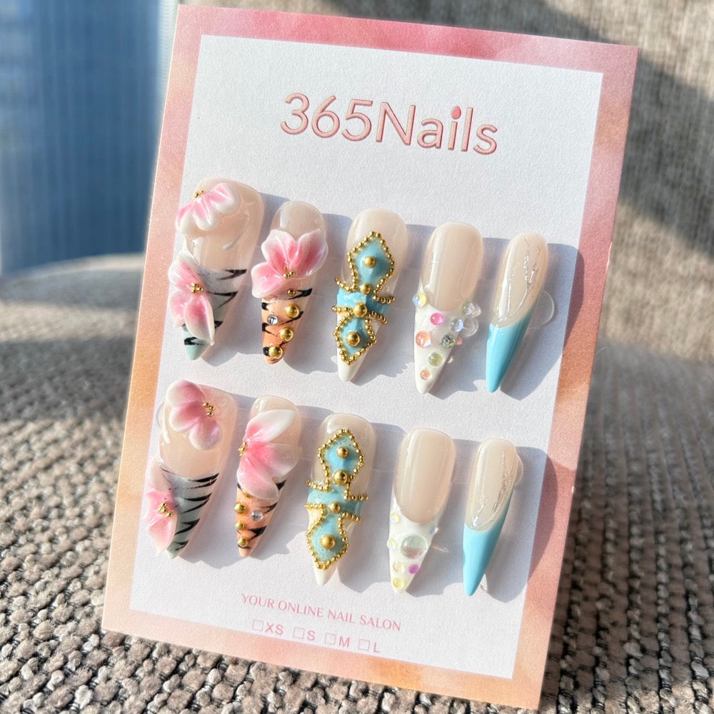 Sculpted Flora: "Baroque Tiger & Pink Flora" – 3D Pink Flowers on Tiger Print with Blue Jeweled Cross Stiletto Nails