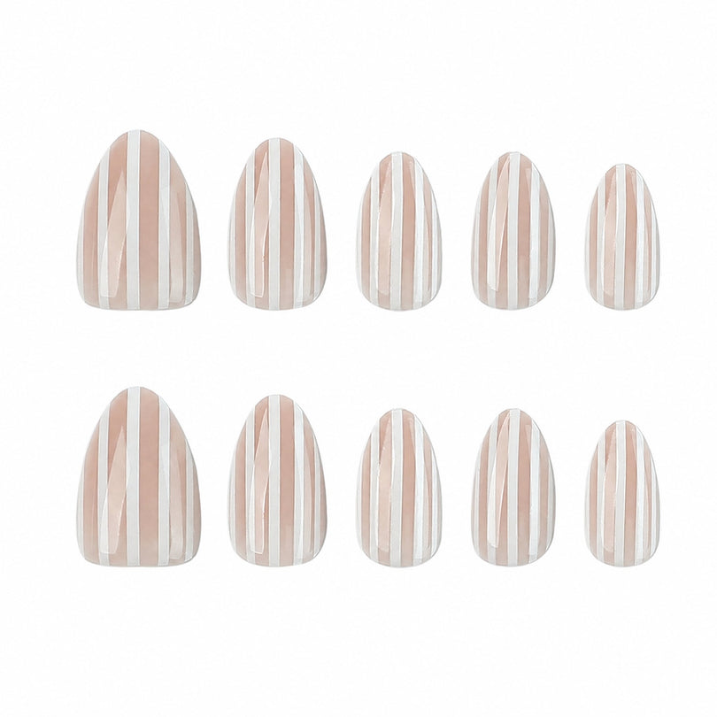 Ten nude and white striped press-on nails in assorted sizes on white background