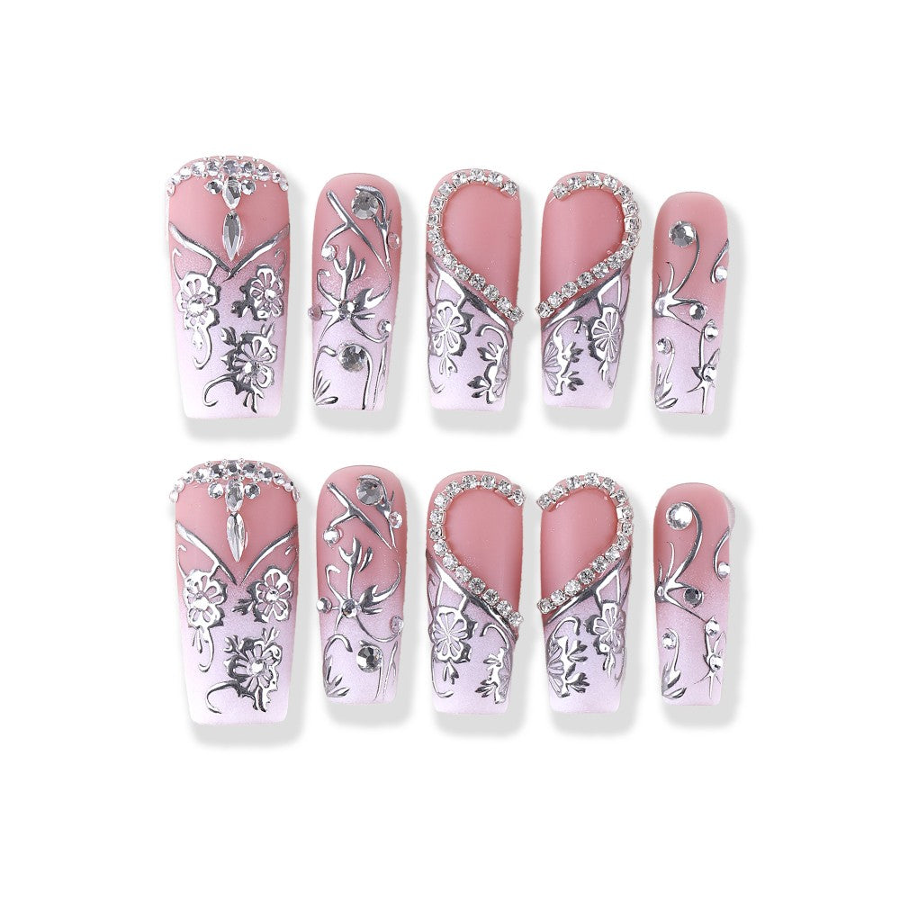 Silver embossed floral design with S-shaped diamond accents, pinkish-white square design Press On Nail