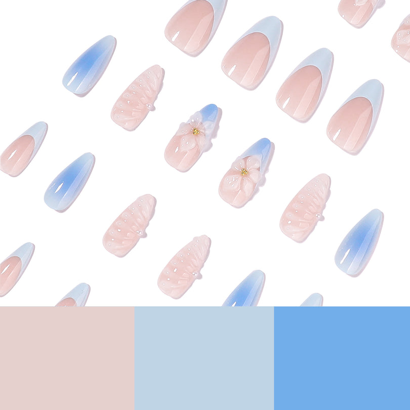 Scattered press-on nails with pink and blue color swatches at the bottom